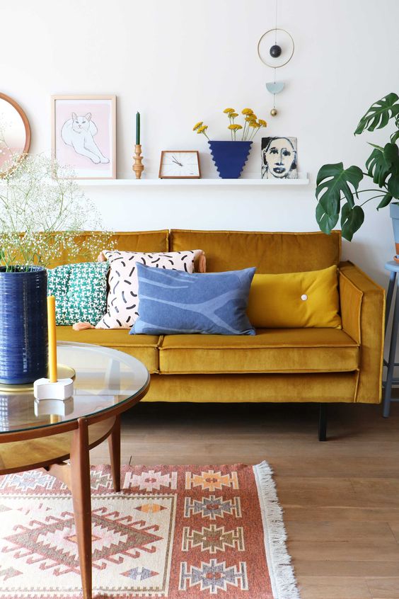 a lively living room with a mustard sofa